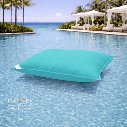 Premium Poolkissen Maxi 190x130 cm von chillisy in Mint im Pool mit Meeranschluss treibend.